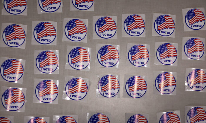 A file photos shows stickers reading "I Voted" available to those who cast ballots at the Fairfax County Government Center on November 02, 2021 in Fairfax, Virginia. (Chip Somodevilla/Getty Images)