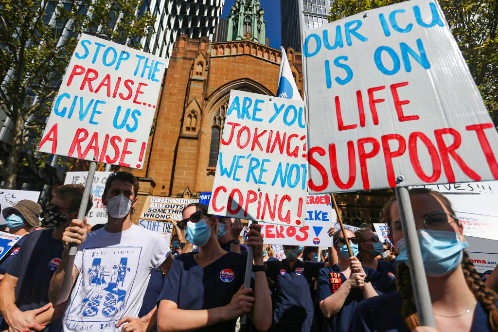 Nurses and members of the health sector rally outside Parliament House in Sydney, Australia, on Feb. 15, 2022. (Lisa Maree Williams/Getty Images)