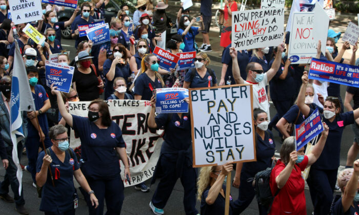 Nurses and members of the health sector rally outside Parliament House in Sydney, Australia, on Feb. 15, 2022. (Lisa Maree Williams/Getty Images)
