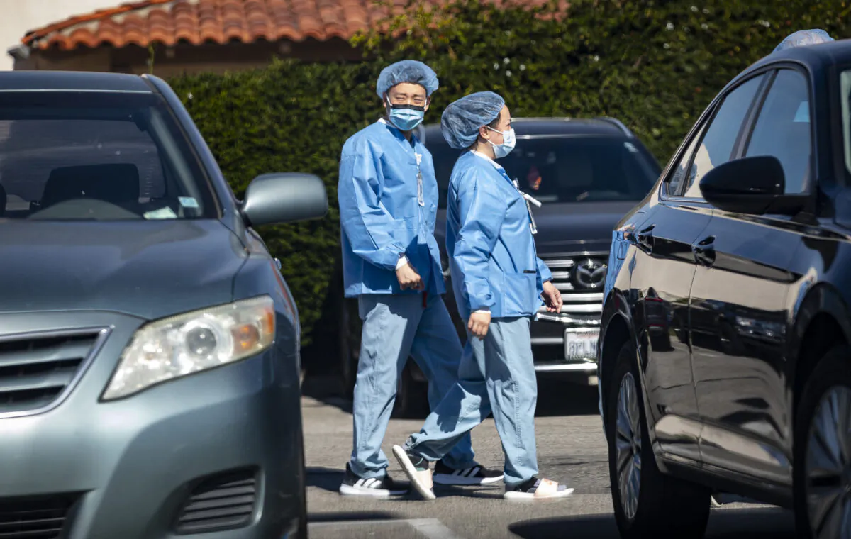 Healthcare workers protest for the rights of staff and patients at West Anaheim Medical Center in Anaheim, Calif., on Feb. 14, 2022. (John Fredricks/The Epoch Times)