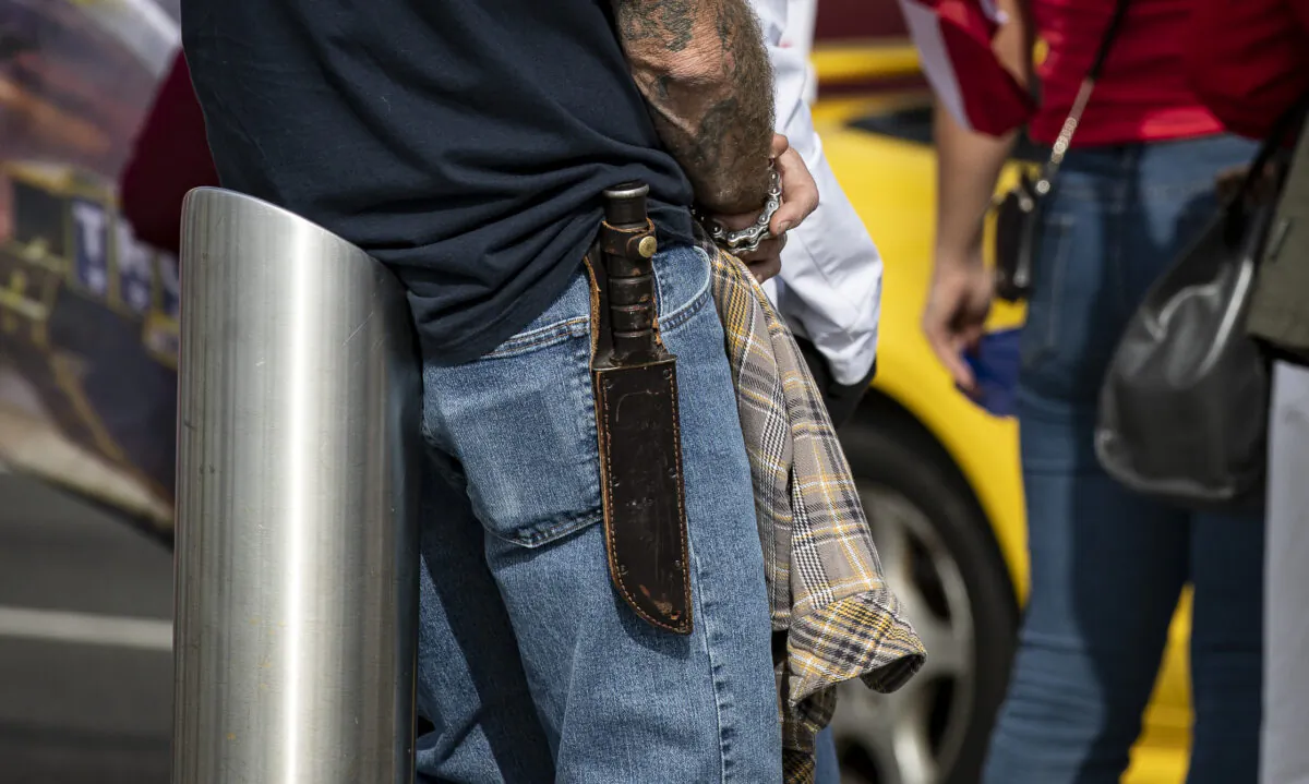 A man carries a knife in Huntington Beach, Calif., on Jan. 6, 2021. (John Fredricks/The Epoch Times)