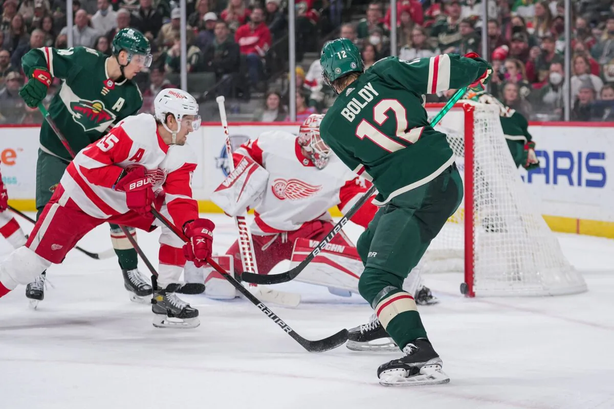 Matt Boldy (12) scores his third goal against the Detroit Red Wings in the second period at Xcel Energy Center, in Saint Paul, Minn., on Feb. 14, 2022. (Brad Rempel/USA TODAY Sports via Field Level Media)