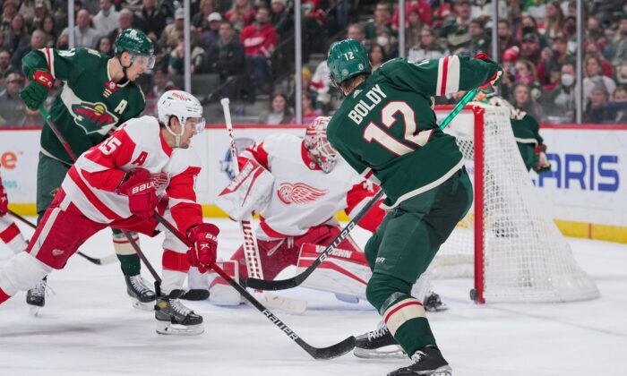 Matt Boldy (12) scores his third goal against the Detroit Red Wings in the second period at Xcel Energy Center, in Saint Paul, Minn., on Feb. 14, 2022. (Brad Rempel/USA TODAY Sports via Field Level Media)