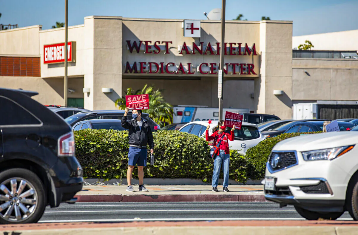 Healthcare workers protest for the rights of staff and patients at West Anaheim Medical Center in Anaheim, Calif., on Feb. 14, 2022. (John Fredricks/The Epoch Times)