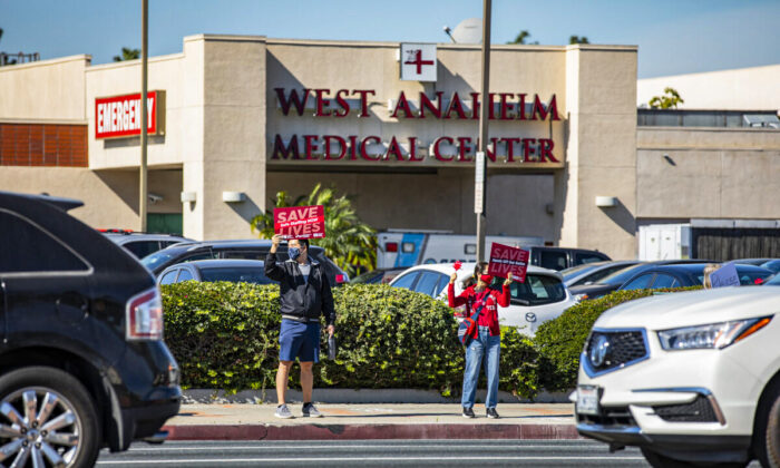 Healthcare workers protest for the rights of staff and patients at West Anaheim Medical Center in Anaheim, Calif., on Feb. 14, 2022. (John Fredricks/The Epoch Times)