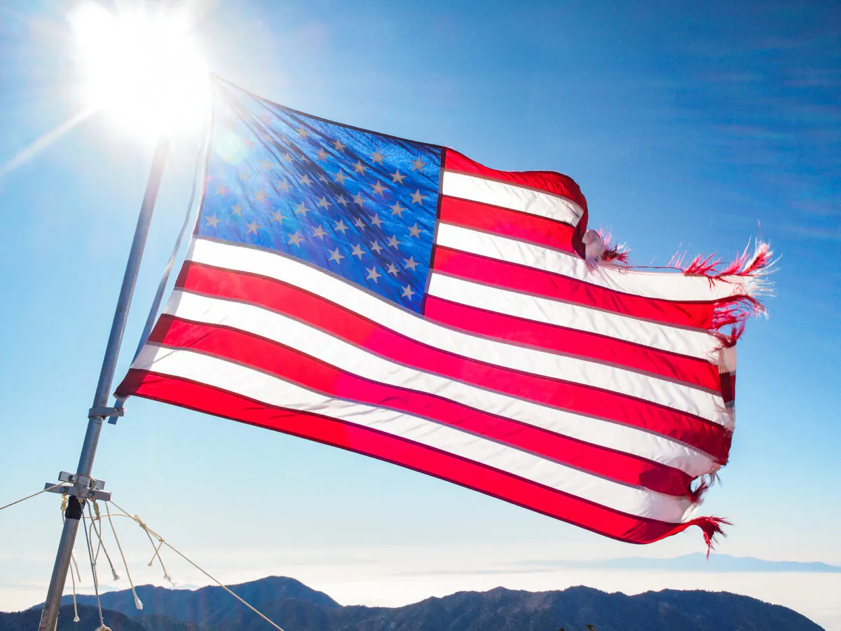 An American flag waves in the wind on top of Mt. Baldy, in Los Angeles County on Oct. 21, 2011. (John Fredricks/The Epoch Times)