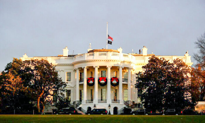 The White House is seen at sunrise, from the South Lawn Driveway in Washington, on Dec. 7, 2021. (Tom Brenner/Reuters)