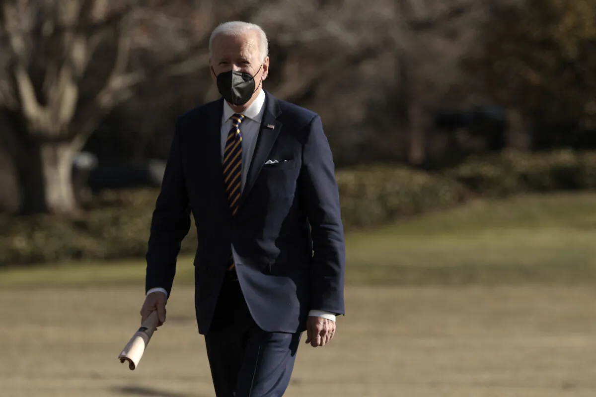 President Joe Biden walks across the South Lawn after returning on Marine One to the White House in Washington on Feb. 10, 2022. (Anna Moneymaker/Getty Images)