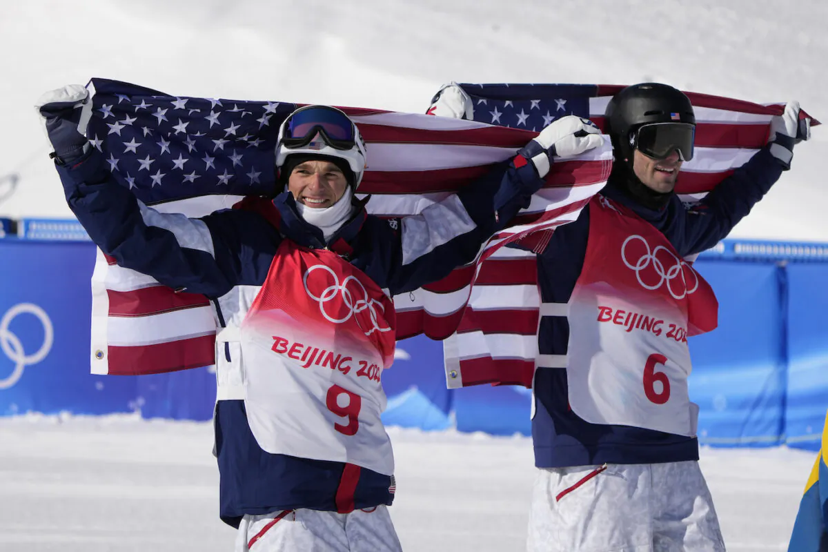 Silver medal winner United State's Nick Goepper (9) and Gold medal winner United States' Alexander Hall (6) celebrates after the men's slopestyle finals at the 2022 Winter Olympics, in Zhangjiakou, China, on Feb. 16, 2022. (AP Photo/Lee Jin-man)