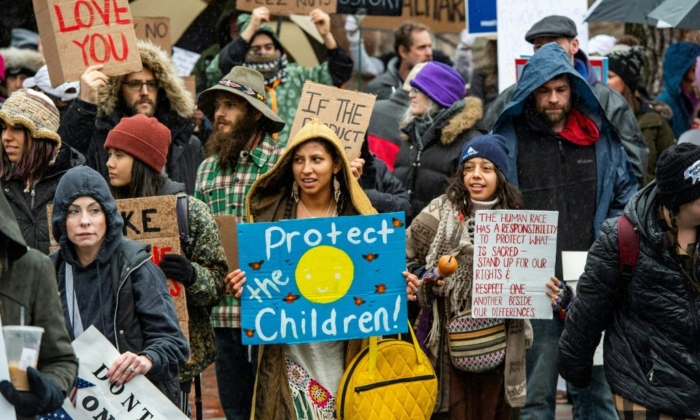 Demonstrators protest masks, vaccine mandates and vaccine passports, with some supporting vaccines, at the State House in Boston, Massachusetts on January 5, 2022. (JOSEPH PREZIOSO/AFP via Getty Images)