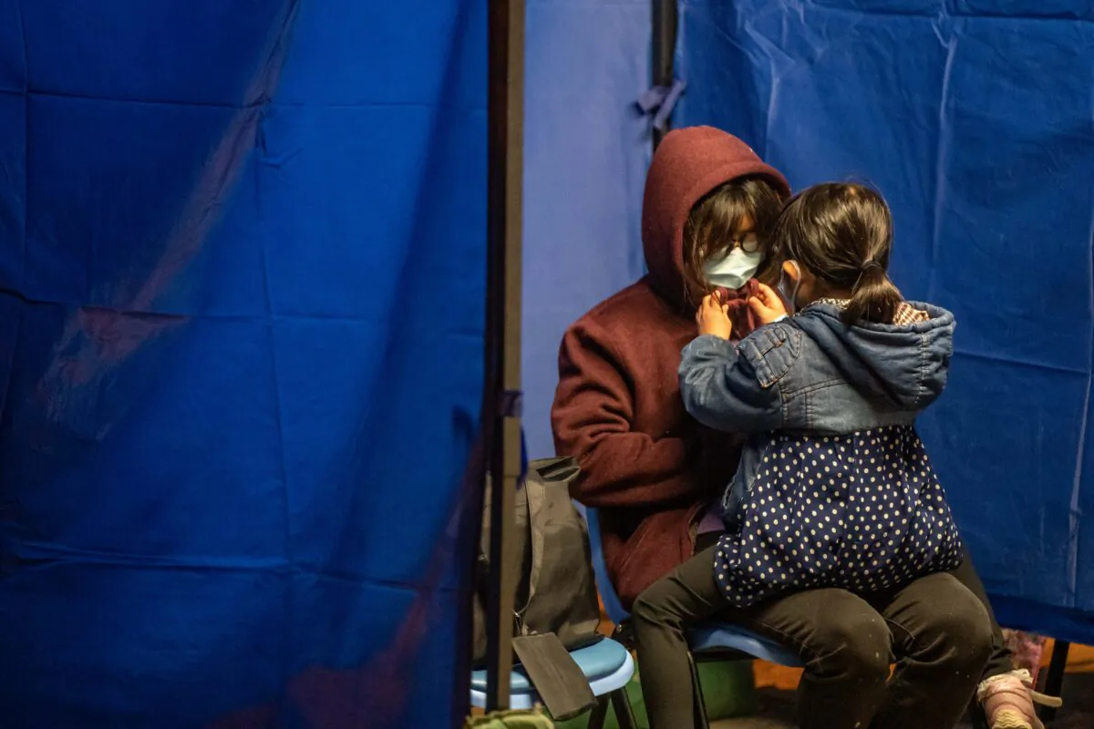 Patients wait at a temporary holding area outside Caritas Medical Centre in Hong Kong on Feb. 16, 2022. (Anthony Kwan/Getty Images)