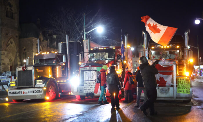 Trucks and protesters block downtown streets near the Parliament Buildings in Ottawa on Feb. 15, 2022. (Scott Olson/Getty Images)