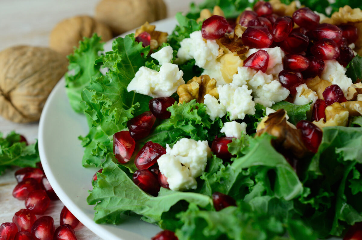 Fresh kale salad with pomegranate seeds By life-is-adventure/Shutterstock