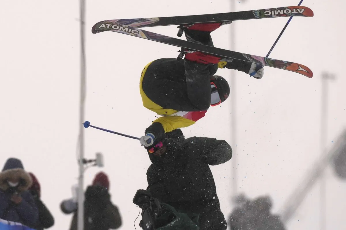 Finland's Jon Sallinen collides with a cameraman during the men's halfpipe qualification at the 2022 Winter Olympics in Zhangjiakou, China, on Feb. 17, 2022. (Francisco Seco/AP Photo)