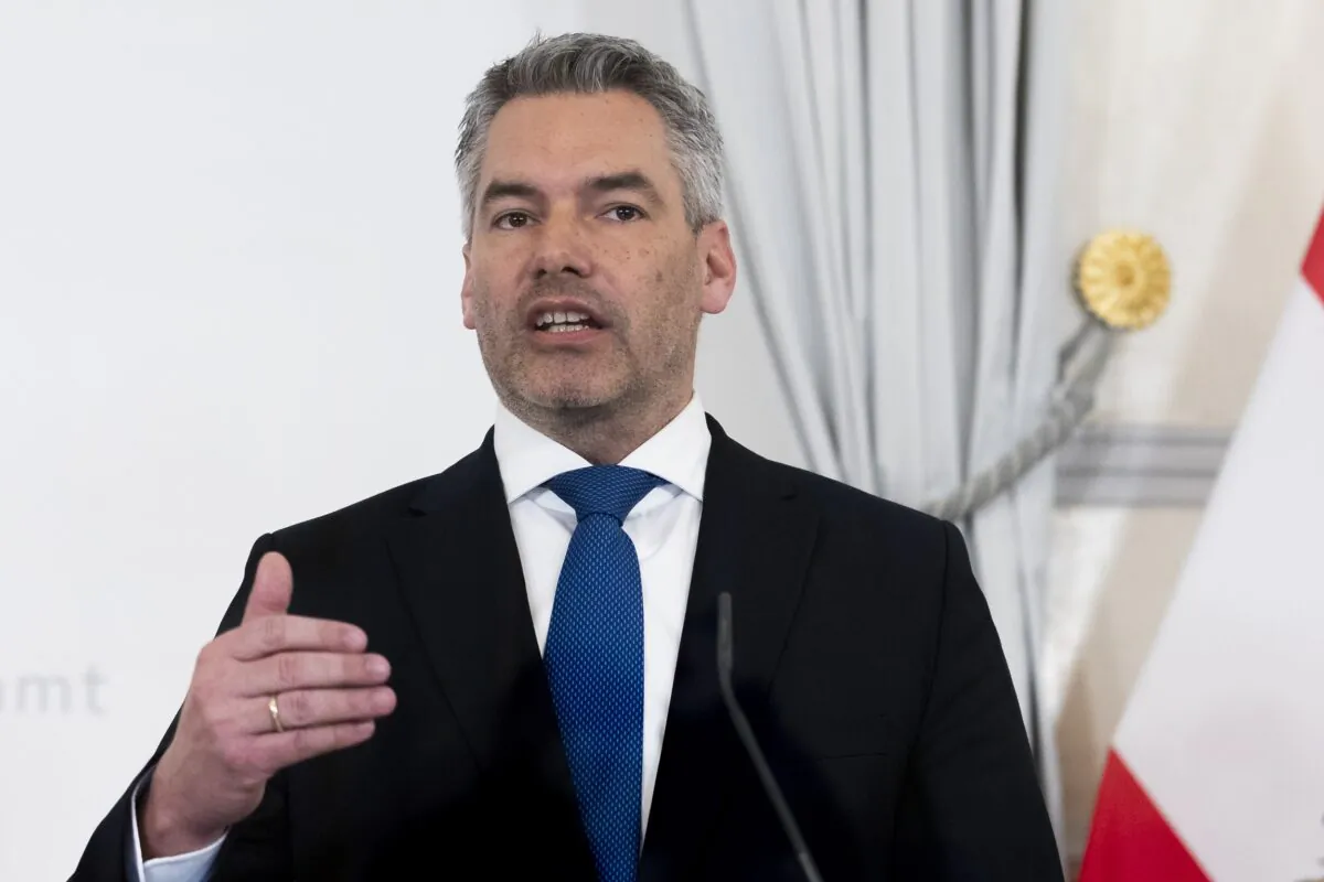 Austria's Chancellor Karl Nehammer presents the new COVID19- regulations at a news conference in Vienna, on Feb. 16, 2022. (Lisa Leutner/AP Photo)