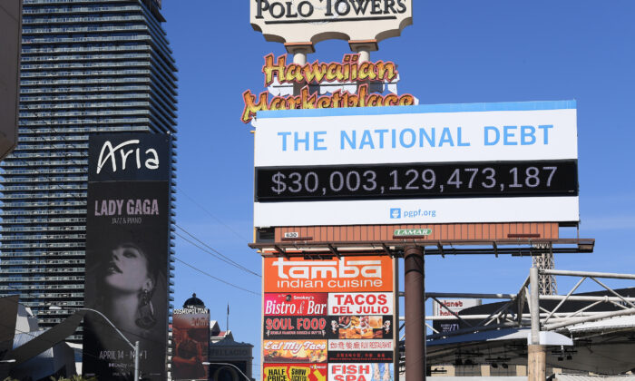 A Peterson Foundation billboard displaying the national debt and each American's share is pictured in Las Vegas, Nev., on Feb. 8, 2022. (Bryan Steffy/Getty Images for Peter G. Peterson Foundation)