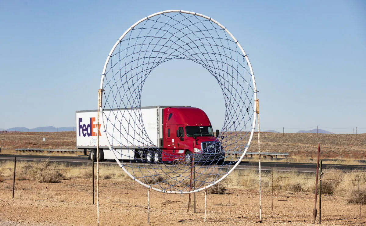 Semi Trucks pass through the state of Arizona on Dec. 3, 2021. (John Fredricks/Epoch Times)