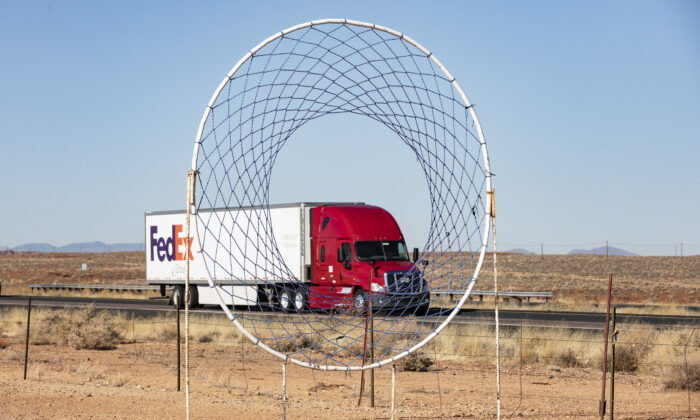 Semi Trucks pass through the state of Arizona on Dec. 3, 2021. (John Fredricks/Epoch Times)