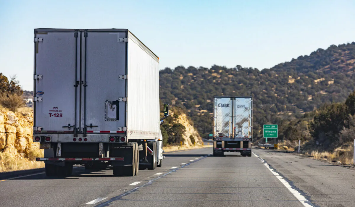 Semi trucks pass through the state of Arizona on Dec. 3, 2021. (John Fredricks/Epoch Times)