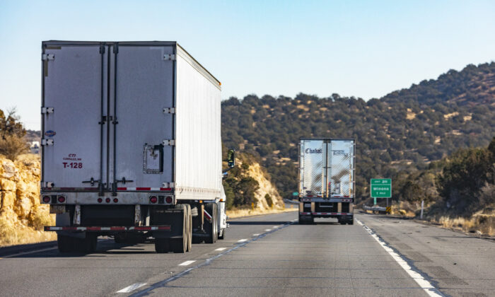 Semi trucks pass through the state of Arizona on Dec. 3, 2021. (John Fredricks/Epoch Times)