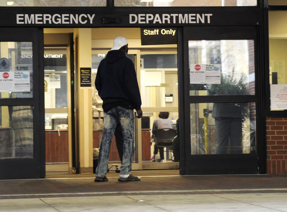 A man enters the emergency room at UAB Hospital in Birmingham, Ala., on Jan. 5, 2022. . (Jay Reeves/AP Photo)