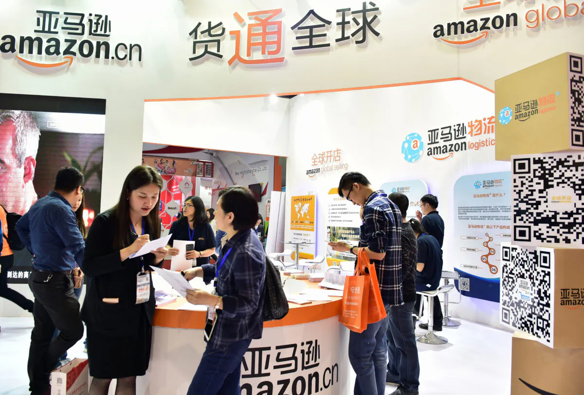 Visitors gathering at an Amazon booth during the 2016 China International Electronic Commerce Expo in Yiwu, east China's Zhejiang Province, on April 11, 2016. (STR/AFP via Getty Images)