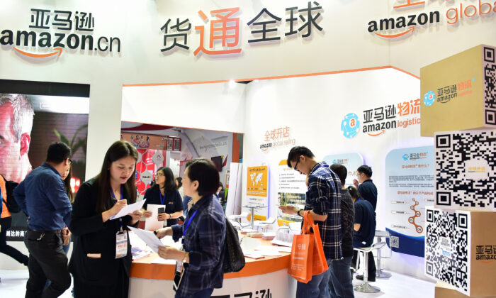 Visitors gathering at an Amazon booth during the 2016 China International Electronic Commerce Expo in Yiwu, east China's Zhejiang Province, on April 11, 2016. (STR/AFP via Getty Images)