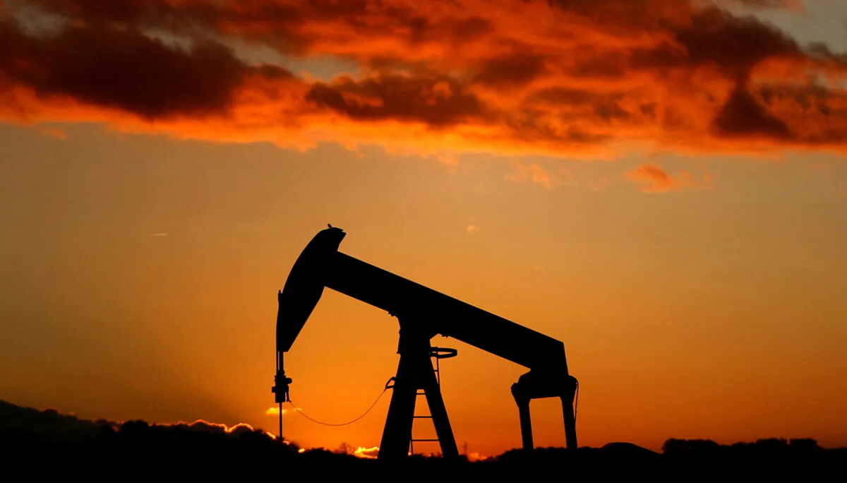 An oil pump is seen at sunset outside Scheibenhard, near Strasbourg, France, on Oct. 6, 2017. (Christian Hartmann/Reuters)