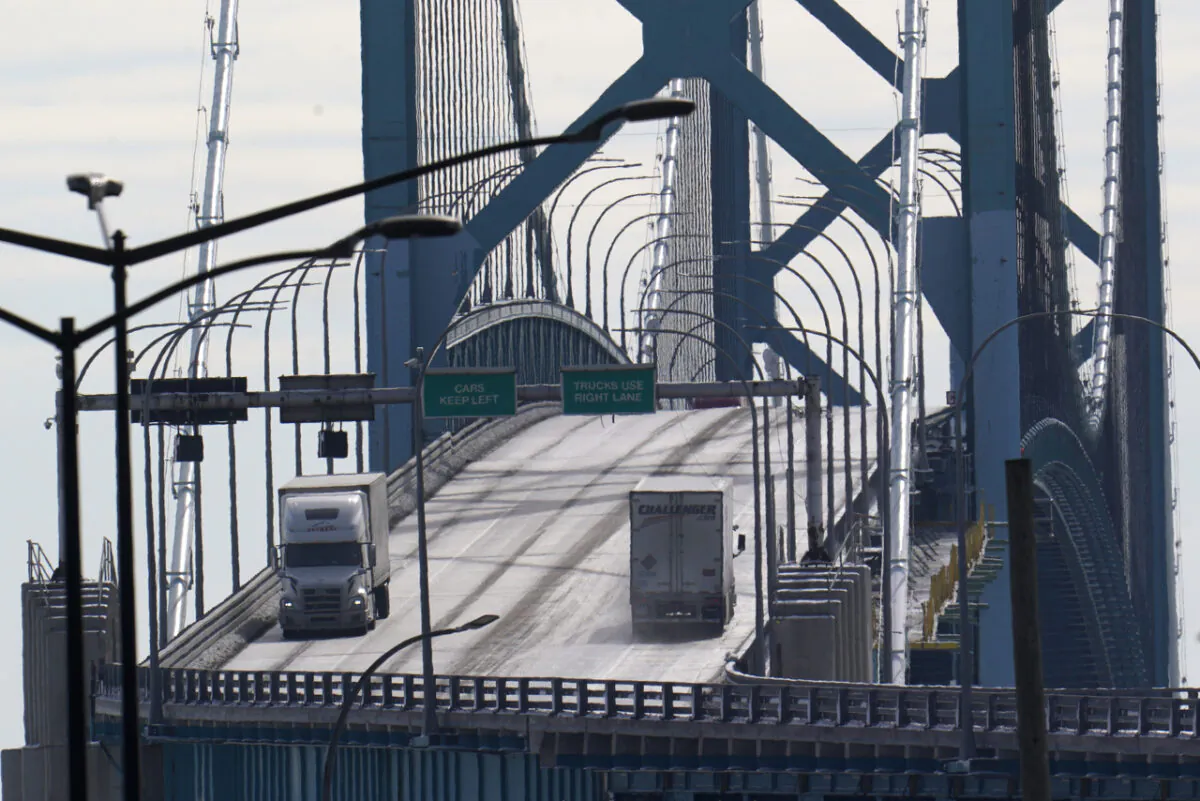 Traffic flows over the Ambassador Bridge in Detroit on Feb. 14, 2022 after protesters blocked the major border crossing for nearly a week in Windsor, Ont. (AP Photo/Paul Sancya)