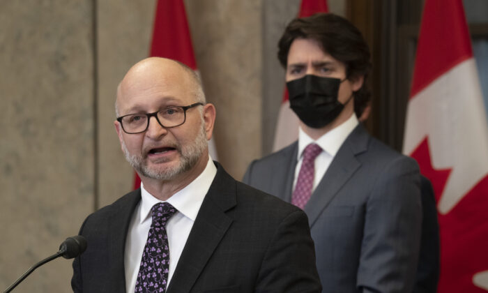 Canadian Prime Minister Justin Trudeau looks on as Minister of Justice and Attorney General of Canada David Lametti speaks following the announcement of the Emergencies Act invoked to deal with the protest in Ottawa against federal COVID-19 mandates on Feb. 14, 2022. (Adrian Wyld/The Canadian Press)