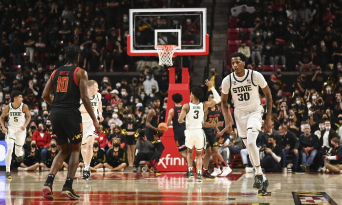 Michigan State Spartans forward Marcus Bingham Jr. (30) reacts after making a three point shot during the second half against the Maryland Terrapins at Xfinity Center in College Park, Md., on Feb 1, 2022. (Tommy Gilligan/USA TODAY Sports via Field Level Media)