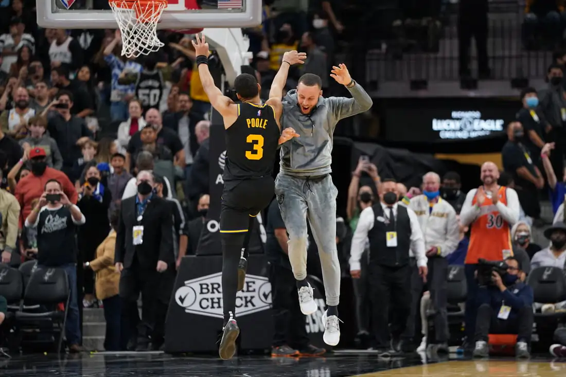 Golden State Warriors guard Jordan Poole (3) and guard Stephen Curry (30) celebrate Poole's three-point7shot late in the second half against the San Antonio Spurs at the AT&T Center at San Antonio, Texas, on Feb 1, 2022. (Daniel Dunn/USA TODAY Sports/via Field Level Media)