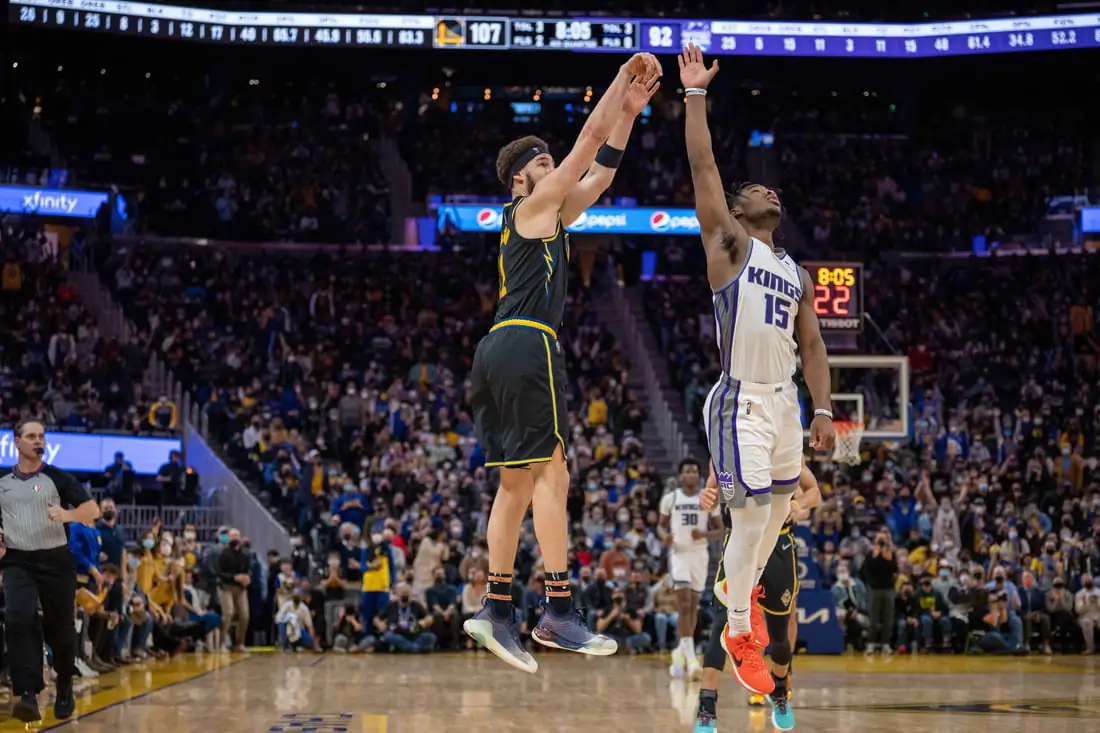Golden State Warriors guard Klay Thompson (11) shoots a three point basket during the fourth quarter against Sacramento Kings guard Davion Mitchell (15) at Chase Center in San Francisco on Feb. 3, 2022. (Neville E. Guard/USA TODAY Sports via Field Level Media)