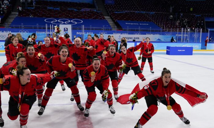 Canada players celebrate with their gold medals after the women's gold medal hockey game at the 2022 Winter Olympics, in Beijing, on Feb. 17, 2022,. (Matt Slocum/AP Photo)