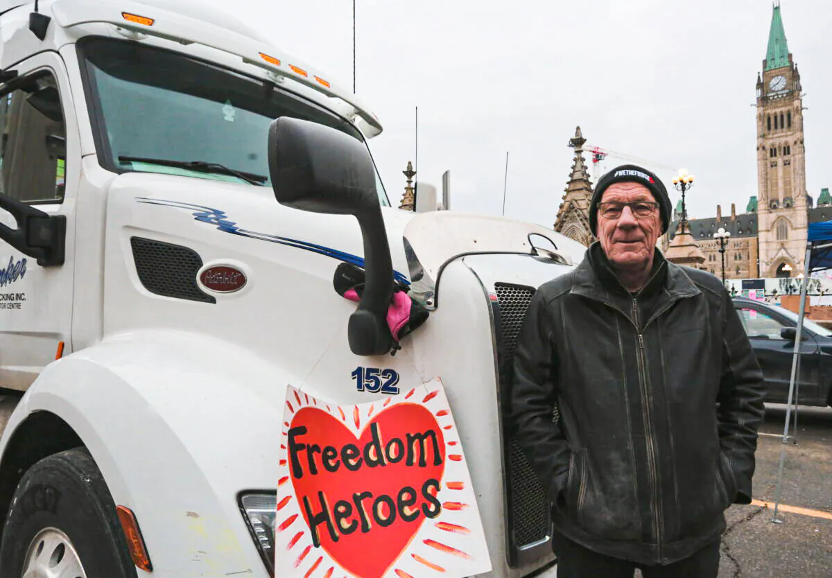 Trucker Bill Dykema, from Ontario, was one of the first protesters to park his rig in the center of Ottawa. He says he is taking action for his 19 grandchildren. (Richard Moore/The Epoch Times)