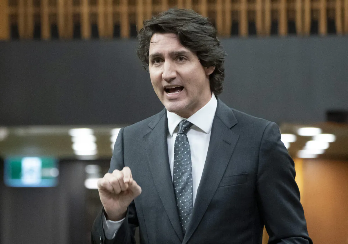 Prime Minister Justin Trudeau rises during Question Period in Ottawa on Feb. 15, 2022. (The Canadian Press/Adrian Wyld)