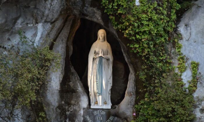 Picture shows the statue of the Virgin Mary, inside the Massabielle cave where the Virgin Mary is said to have appeared to Bernadette Soubirous, in the Sanctuary of Our Lady, in Lourdes, France, on Nov. 5, 2019. (Pascal Pavani/AFP via Getty Images)
