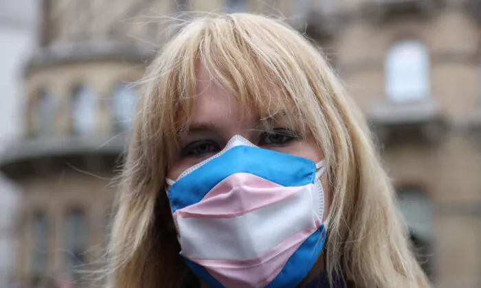 A demonstrators wears a transgender flag face covering during the Trans Activism UK "British Bigotry Corporation: Platforming Hate Is Not Impartial" protest at BBC Broadcasting House on January 8, 2022 in London, England. (Photo by Hollie Adams/Getty Images)