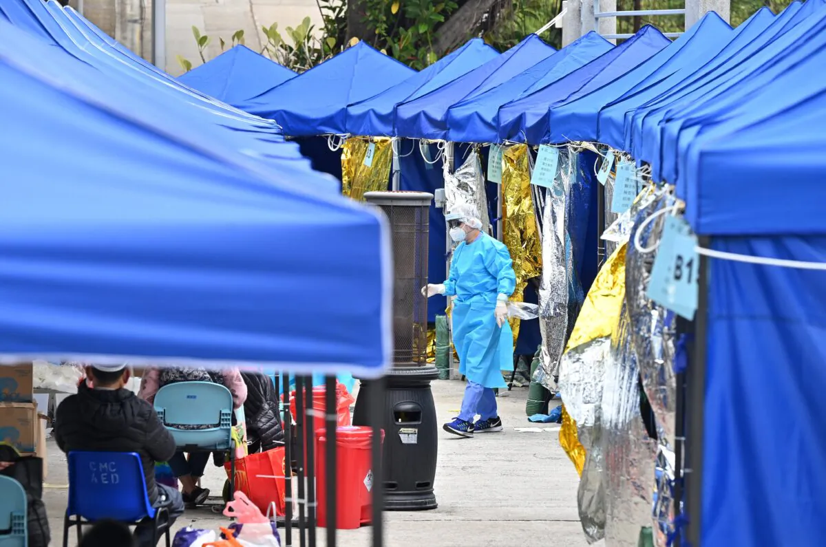 A makeshift camp set up for COVID-19 patients due to limited space inside is pictured outside the Caritas Medical Centre in Hong Kong on Feb. 18, 2022. (Peter Parks/AFP via Getty Images)