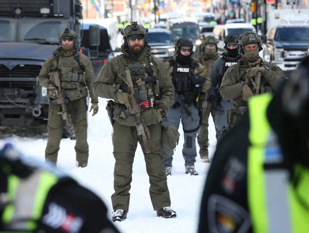 Armed police officers deploy to remove demonstrators against COVID-19 mandates, in Ottawa on Feb. 18, 2022. (Dave Chan/AFP via Getty Images)