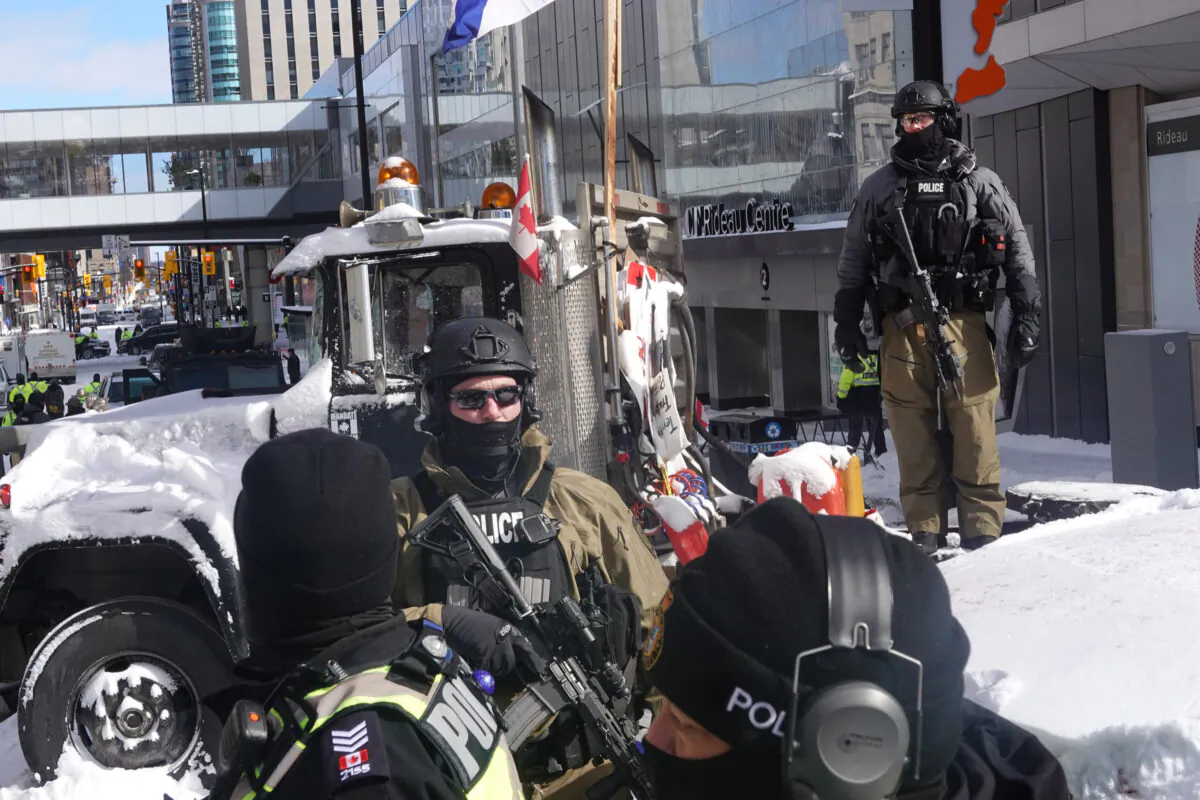 Police begin to break up a protest organized by truck drivers opposing COVID-19 vaccine mandates in Ottawa on Feb. 18, 2022. (Scott Olson/Getty Images)