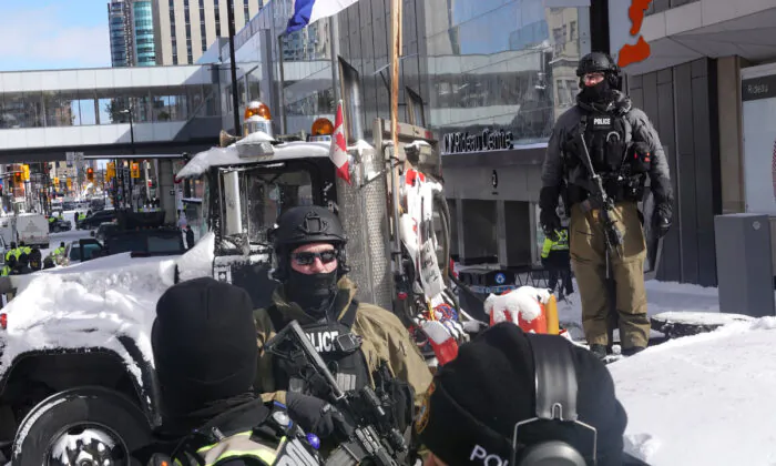 Police begin to break up a protest organized by truck drivers opposing COVID-19 vaccine mandates in Ottawa on Feb. 18, 2022. (Scott Olson/Getty Images)