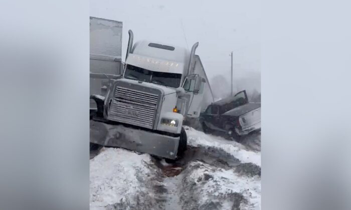 A pileup involving about 100 cars, trucks and big rigs during a snowstorm on Interstate 39 north of Bloomington, Ill., on Feb. 17, 2022. (David Troesser via AP)