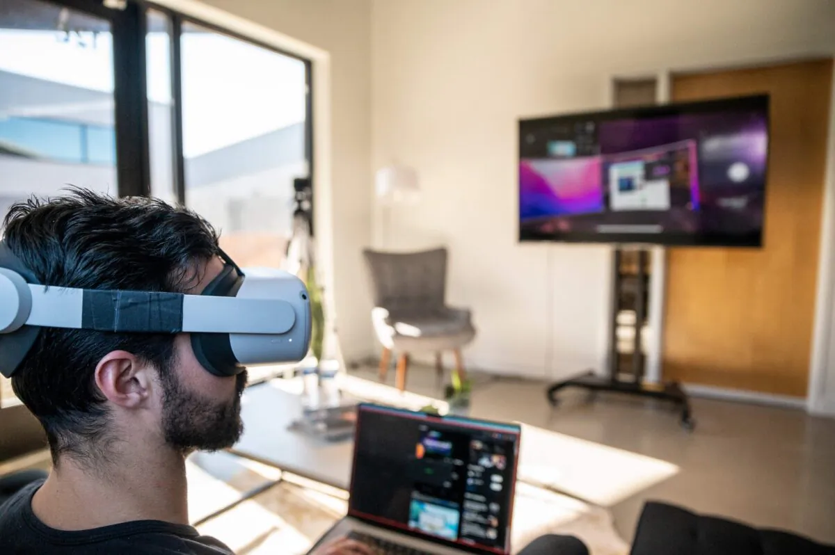 Gavin Menichini, using the Oculus Quest 2 VR headset, gives a demonstration of the Immersed Virtual Reality program which can be used for many applications on Jan. 28, 2022 in Austin, Texas. (Sergio Flores/AFP via Getty Images)