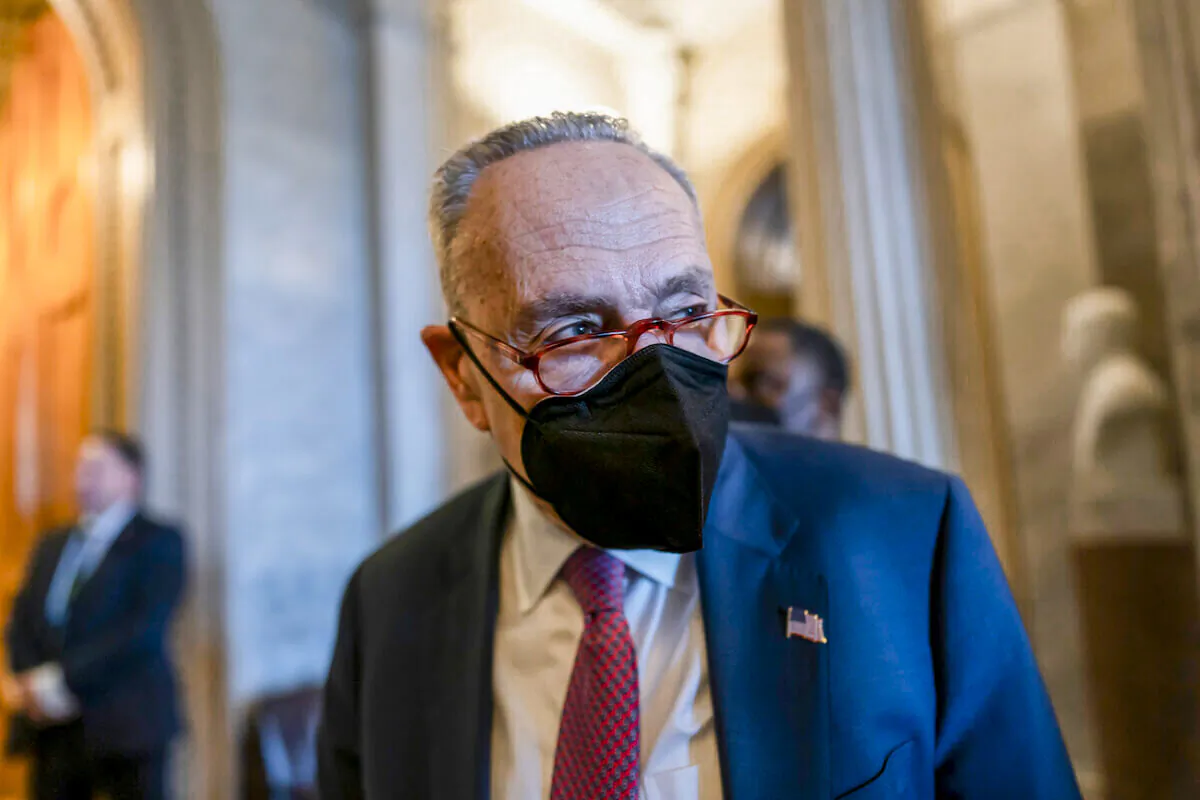 Senate Majority Leader Chuck Schumer (D-N.Y.) tells reporters that the Senate will get the work done to fund the government before the Feb. 18 midnight deadline, at the Capitol in Washington, on Feb. 17, 2022. (AP Photo/J. Scott Applewhite)