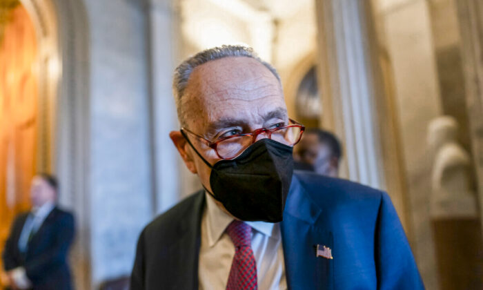 Senate Majority Leader Chuck Schumer (D-N.Y.) tells reporters that the Senate will get the work done to fund the government before the Feb. 18 midnight deadline, at the Capitol in Washington, on Feb. 17, 2022. (AP Photo/J. Scott Applewhite)
