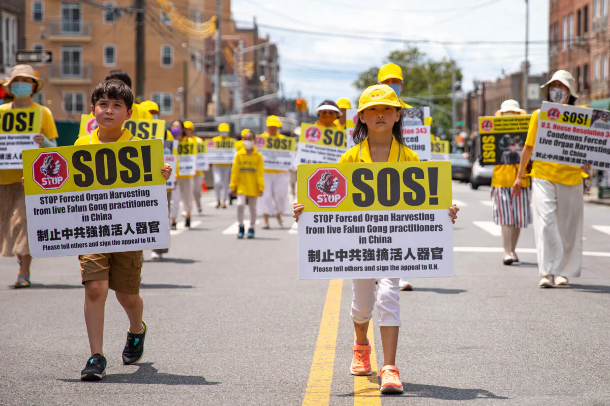 Falun Gong practitioners take part in a parade marking the 22nd year of the persecution of Falun Gong in China, in Brooklyn, N.Y., on July 18, 2021. (Chung I Ho/The Epoch Times)