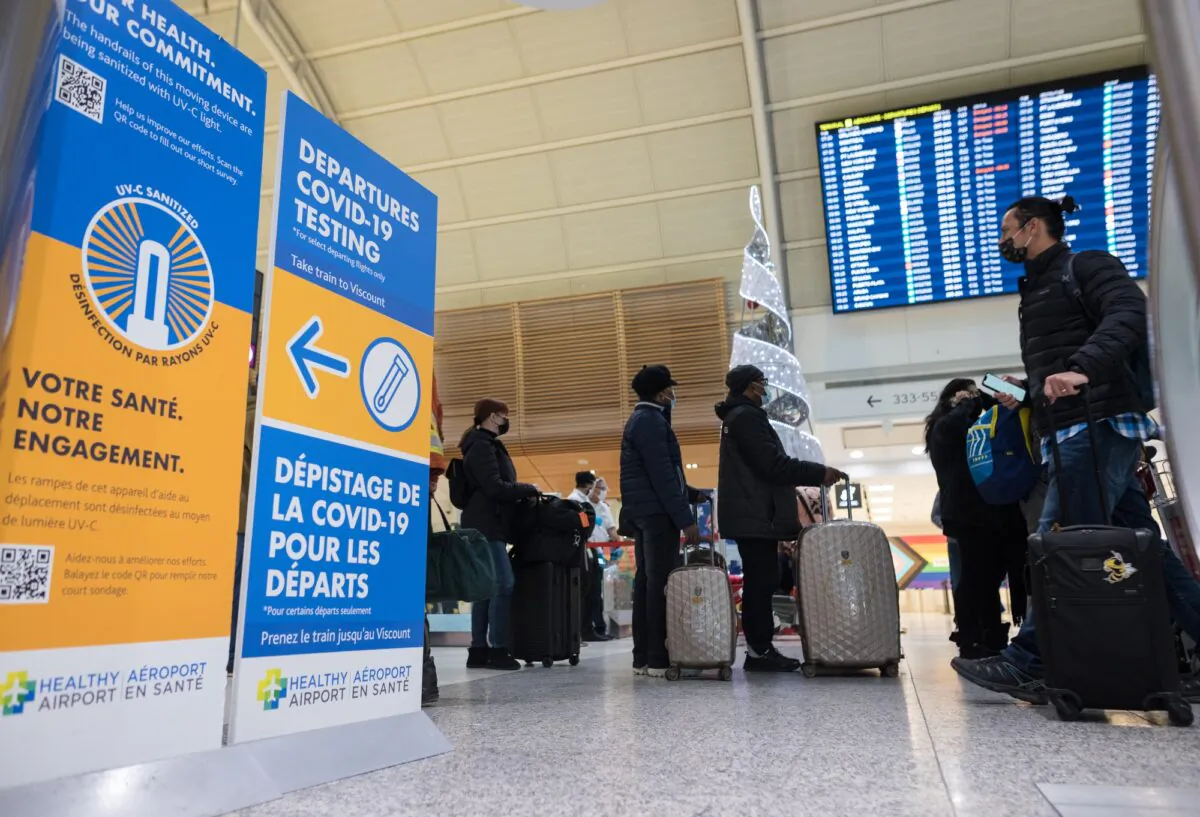 A COVID-19 testing sign at Toronto Pearson International Airport on Dec. 16, 2021. (Tijana Martin/The Canadian Press)