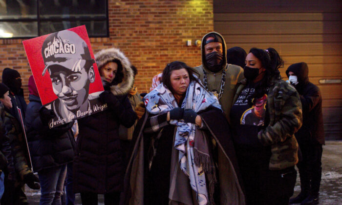 Katie Bryant, Daunte Wright’s mother, is surrounded by community members and activists in Minneapolis, Minn., on Feb. 18, 2022. (Nicole Neri/AP Photo)