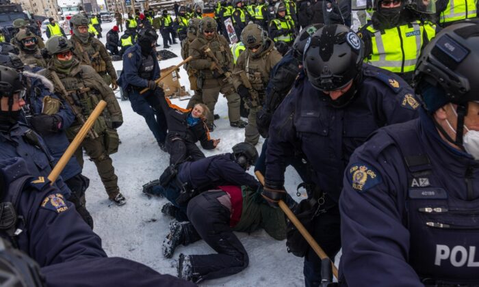Police face off with Freedom Convoy demonstrators in Ottawa on Feb. 19, 2022. (Alex Kent/Getty Images)